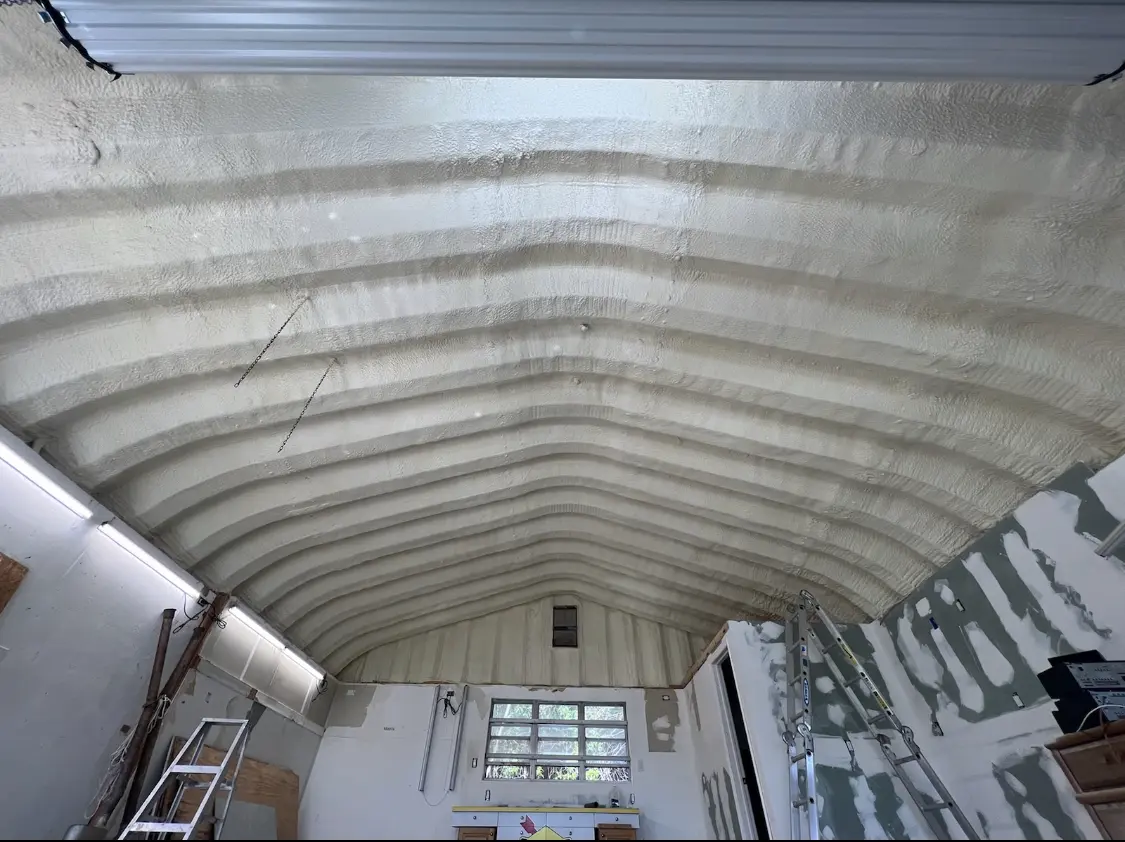 Spray polyurethane foam applied to the underside of a metal roof deck in Belle Haven